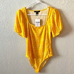 yellow bodysuit
